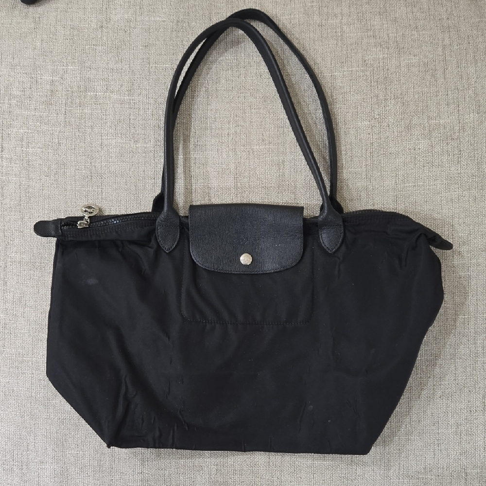 Longchamp Black Tote Bag with Leather Handles and Flap Closure